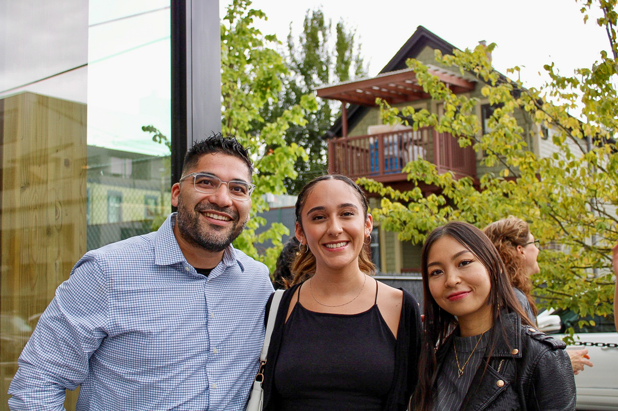 Three Script interns smiling at an outdoor social event